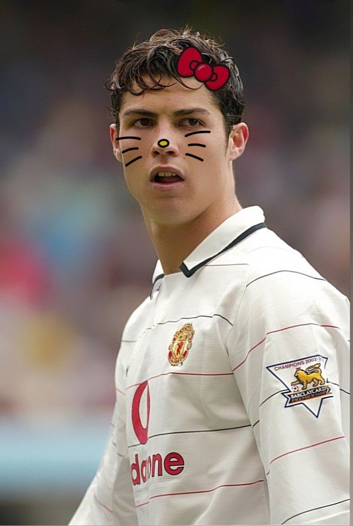 a young man with cat's face painted to look like he is ready for the soccer game