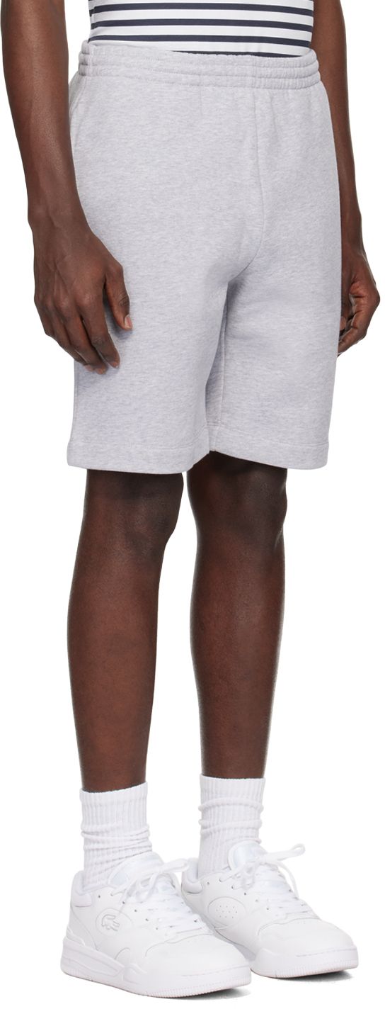 Straight-leg organic cotton- and recycled polyester-blend fleece shorts. · Concealed drawstring at elasticized waistband · Three-pocket styling · Embroidered logo patch at front Supplier color: Silver Casual Shorts With Ribbed Waistband, Casual Relaxed Fit Athletic Shorts With Ribbed Waistband, Casual Athletic Shorts With Ribbed Waistband, Casual Athletic Shorts With Comfort Waistband, Solid Cotton Athletic Shorts For Streetwear, Gray Cotton Sportswear Shorts, Grey Joggers, Fleece Shorts, Jogger Shorts