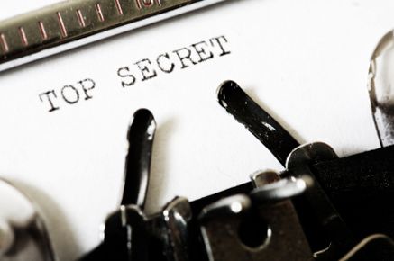 an old fashioned typewriter with the words top secret on it's paper and keys