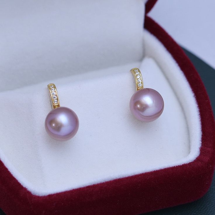 Freshwater pearls shimmer with very light overtones and classic purple body color seamlessly forming a single row of style distinction--an elegant look that only pearls can truly offer, setting them apart from any other gemstone or fine jewelry design. Materials: AAAA Freshwater Pearls, Size9-10mm, 925 sterling silver A FREE luxury jewelry box is included for high-quality pearl items. Product Information Pearl Type Freshwater Origin China Shape Round Quality AAAA Size 9-10 mm Nacre Very Thick Co Elegant Purple Pearl Earrings For Anniversary, Elegant Purple Pearl Earrings, Elegant Purple Pearl Earrings For Formal Occasions, Fine Jewelry Design, Luxury Jewelry Box, Golden South Sea Pearls, Mabe Pearl, Purple Pearl, Cz Earrings