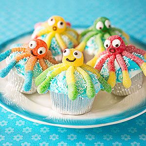 cupcakes decorated like octopuses on a plate