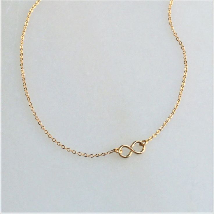 This gold infinity necklace is the perfect daily reminder that some things are for infinity! A wonderful addition to your minimalist jewelry collection or as a meaningful gift! •100% 14kt Gold Water friendly Model is wearing 16 inch in photos. Minimalist Gold Infinity Jewelry, Dainty Infinity Jewelry For Bridesmaid Gift, Minimalist Infinity Gold Jewelry, Minimalist Infinity Necklace With Delicate Chain, Dainty Gold Infinity Necklace, Minimalist Gold Infinity Necklace, Minimalist Infinity Gold Necklace, Adjustable Minimalist Infinity Necklace, Minimalist Adjustable Infinity Necklace