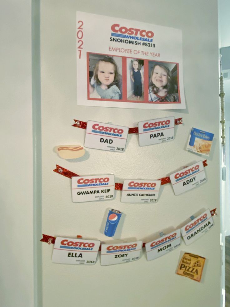 a bulletin board with some pictures hanging from it's sides and magnets attached to the wall