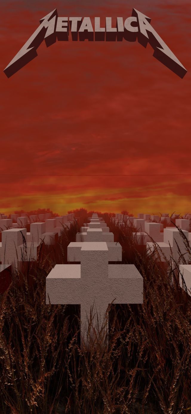 an image of a metallic cross in the middle of a field with red sky behind it