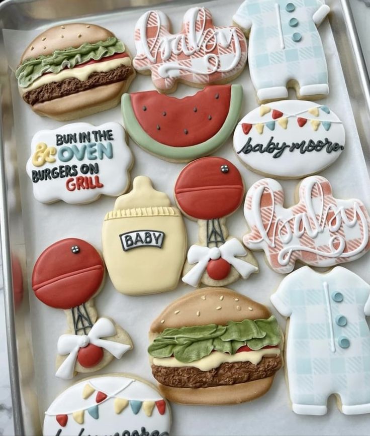 decorated cookies in the shape of hamburgers, hot dogs, and watermelon