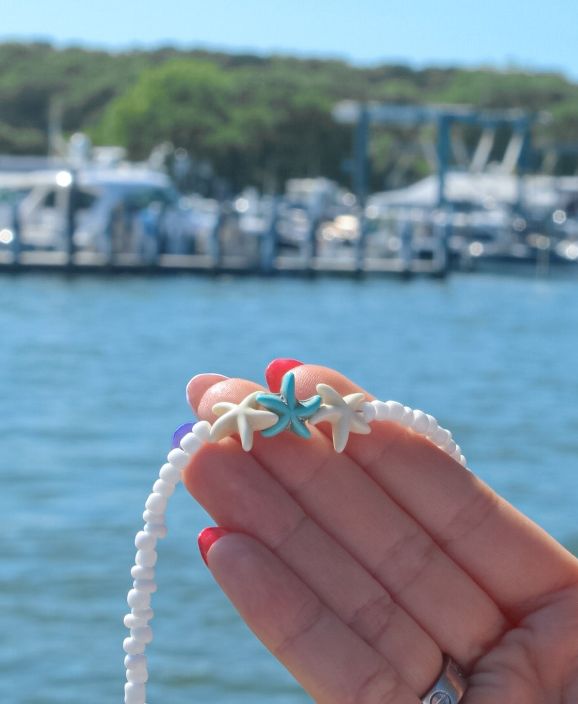 White Star-shaped Ocean-inspired Jewelry, Ocean-inspired White Star Jewelry, Ocean-inspired White Star-shaped Jewelry, White Starfish Jewelry For Vacation, White Starfish Beach Jewelry, White Starfish Pendant Ocean-inspired Jewelry, White Star-shaped Jewelry With Starfish Charm, White Starfish Charm Jewelry For Vacation, White Starfish Jewelry For Summer