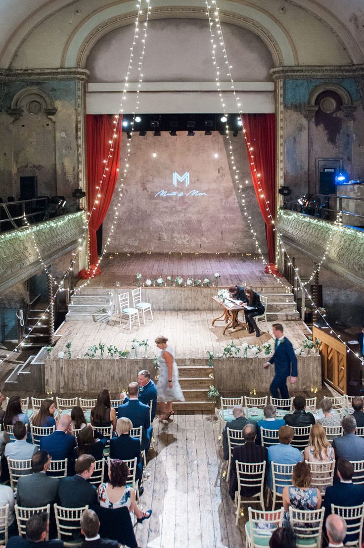 an overhead view of a stage with people sitting on chairs