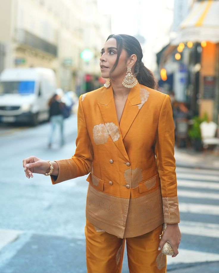 @houseofmisu takes over the Paris streets in our Gul Silk Pantsuit and we're in awe of this look😍💛✨ This pantsuit is absolutely perfect for your festive and wedding Soiree✨✨ Shop the look on the website or dm us for more details. www.shriyasinghi.com . . . . #shriyasinghi #festivewear #silkpantsuit #banarasisilk #fusionwear #modernindian #diwalioutfit #weddingoutfit #shippingworldwide Silk Pantsuit, Silk Pant Suit, Paris Streets, Diwali Outfits, Yellow Mustard, Paris Street, Varanasi, Shop The Look, Look On