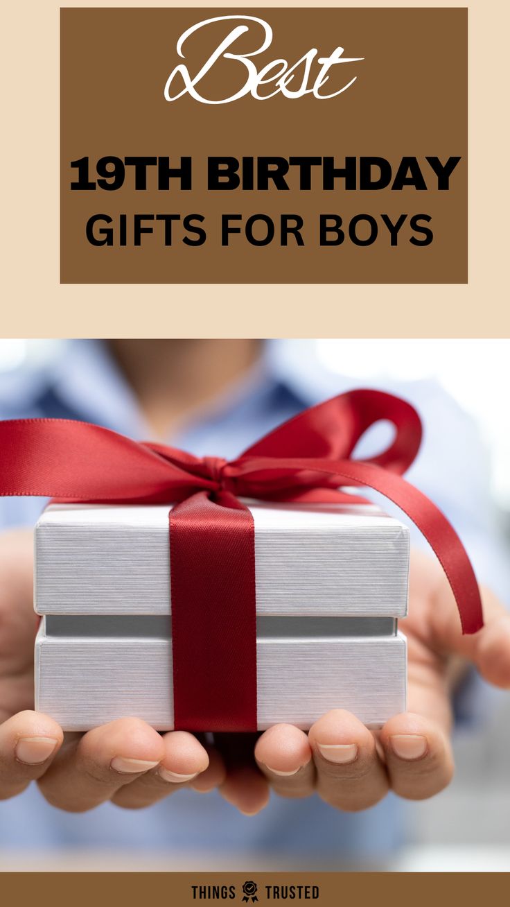 a person holding a present box with the words best 19th birthday gifts for boys