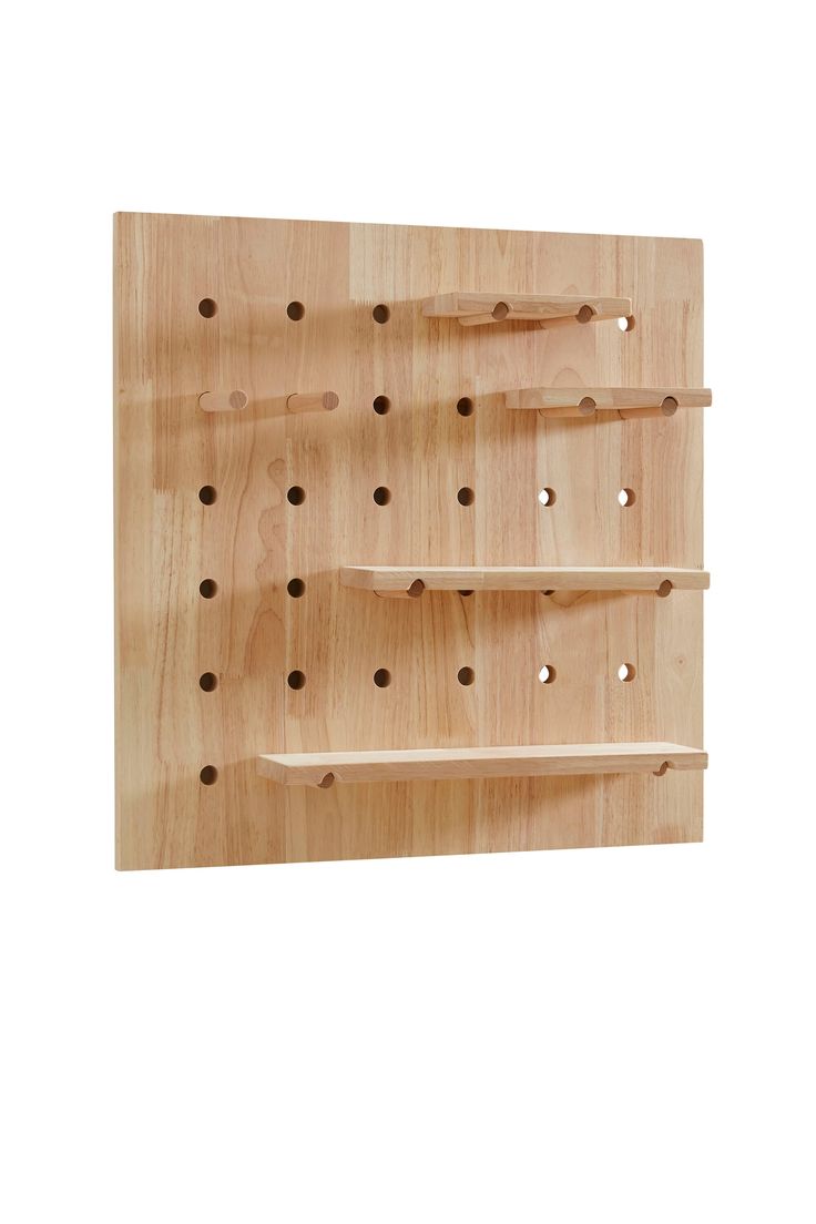 three wooden shelves with holes in them