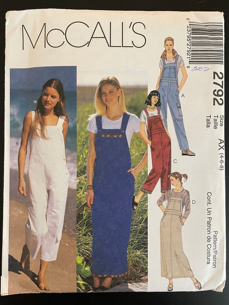 a woman in overalls and overalls standing next to the ocean