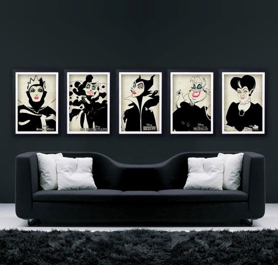 three black and white paintings hang on the wall above a couch in a living room