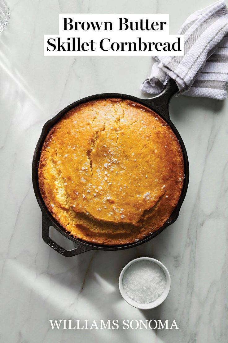 brown butter skillet cornbread in a cast iron skillet on a marble counter