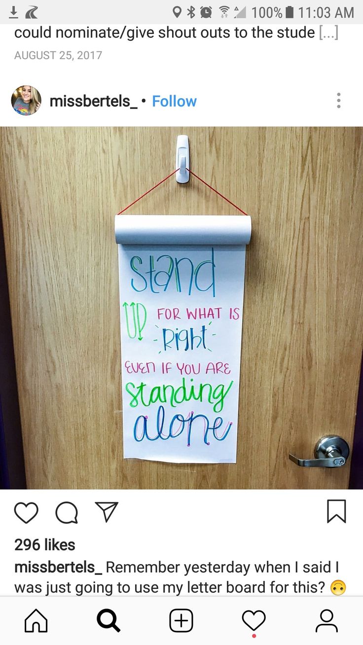 a bulletin board hanging on the door with someone's handwritten note attached to it