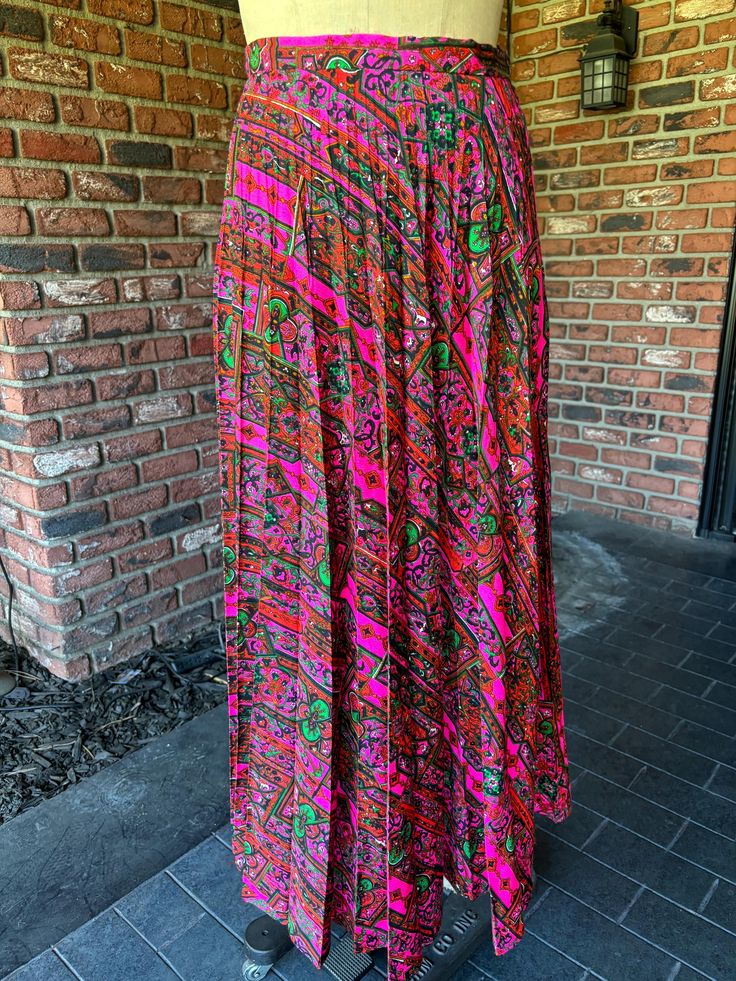 Bright amazing print.  pleats.  side zip. no pockets  waist flat measurement 14" length 39" Bohemian Pleated Relaxed Fit Maxi Skirt, Spring Paisley Print Flowy Maxi Skirt, Spring Flowy Maxi Skirt With Paisley Print, Long Paisley Print Skirt, Flowy Long Paisley Print Skirt, Flowy Long Skirt With Paisley Print, Fitted Long Skirt With Paisley Print, Long Flowy Skirt With Paisley Print, Bohemian Pleated Fitted Maxi Skirt