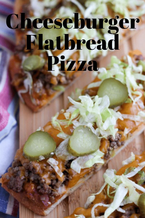 cheeseburger flatbread pizza on a cutting board