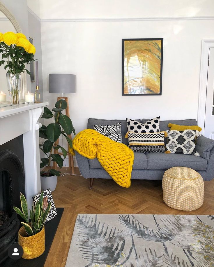 a living room filled with furniture and a fire place