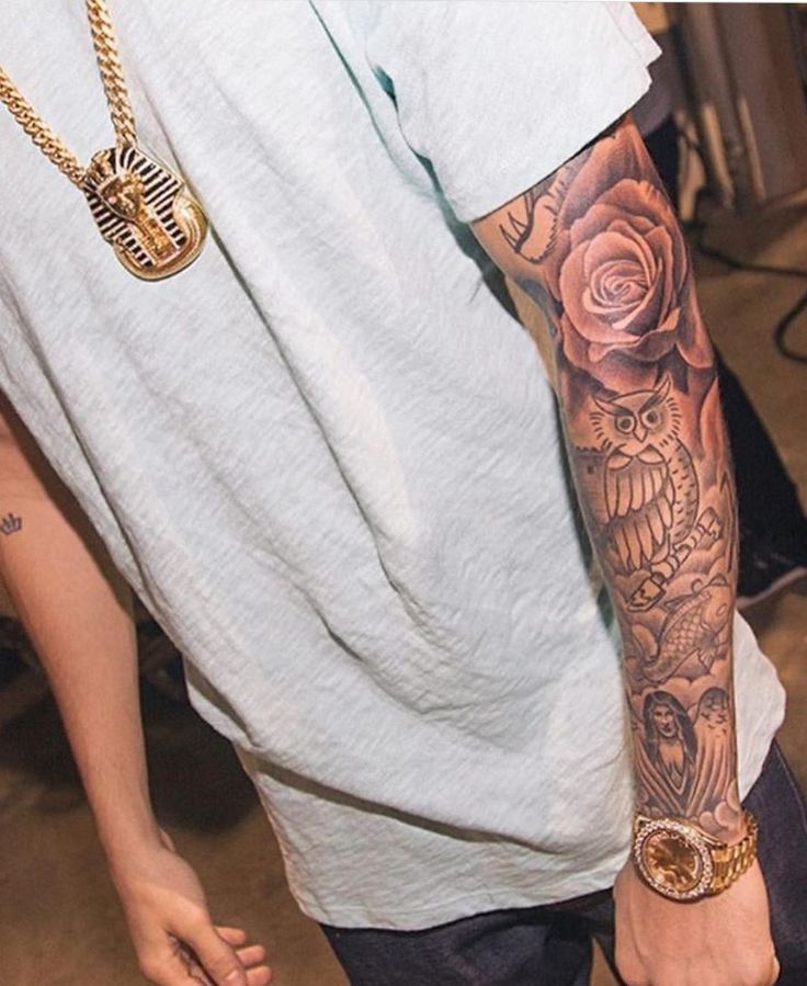 a man with a tattoo on his arm