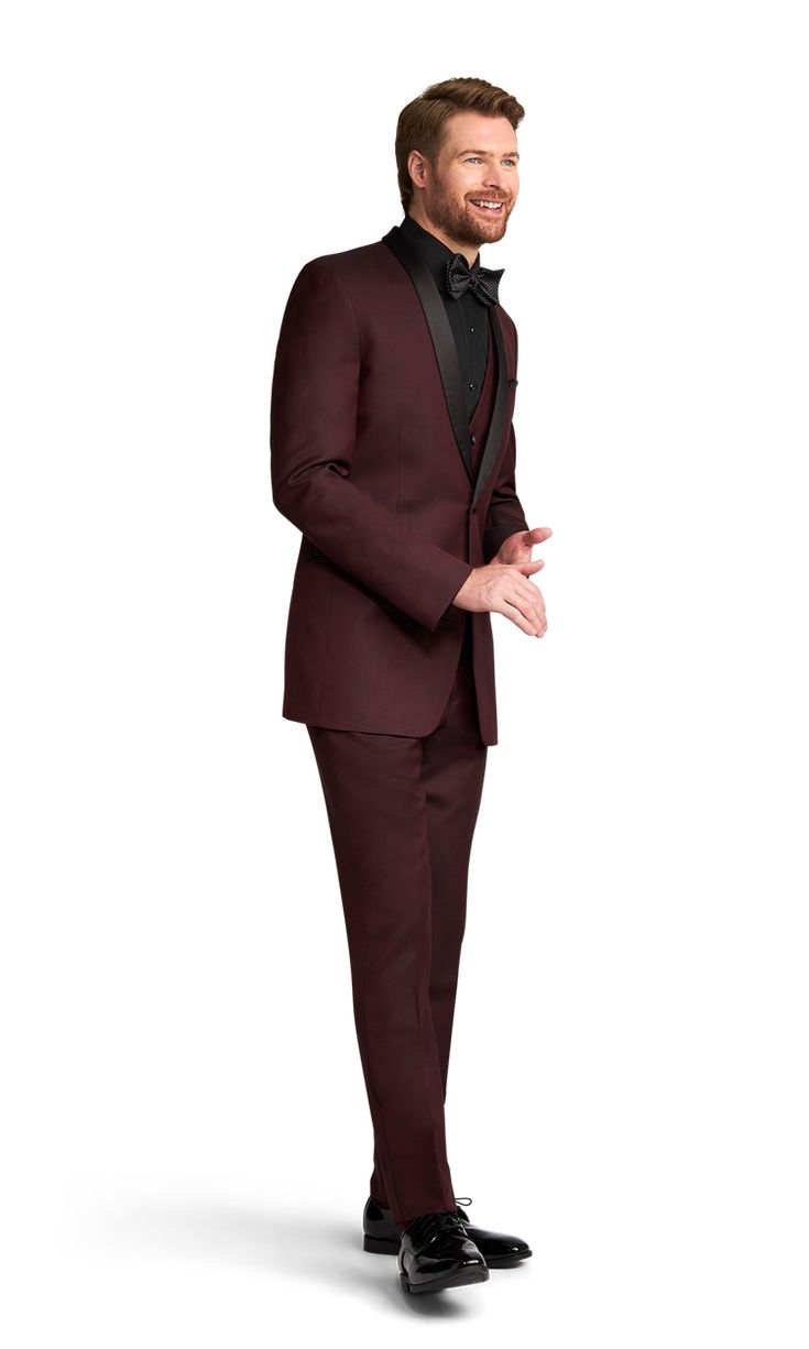 A slim burgundy tuxedo with one button and a shawl lapel. Burgundy Notch Lapel Suit For Formal Occasions, Burgundy Notch Lapel Suits For Formal Occasions, Classic Burgundy Suits With Suit Collar, Classic Burgundy Suit With Suit Collar, Tailored Burgundy Suit For Semi-formal Occasions, Tailored Burgundy Tuxedo For Business, Burgundy Tailored Tuxedo For Business, Tailored Burgundy Business Tuxedo, Elegant Burgundy Blazer For Party