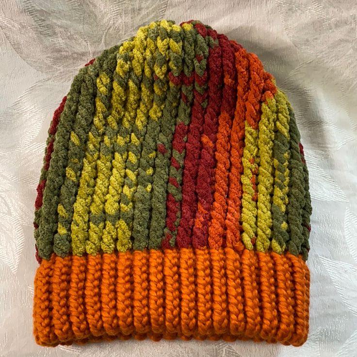 This Hat Was Hand Knitted By Me And Is A Beanie Style Done With Fall Colors! The Body Is An Array Of Greens, Burgundy, And Orange, And The Rim Is A Pretty Fall Orange. The Hat Is Very Soft And Warm And Fits Most! Knit Cap For Fall, Knitted One Size Hat For Fall, One Size Knitted Hat For Fall, Hand Knitted Crochet Hat For Fall, Knitted One-size Hat For Fall, Crochet Knit Hat For Cold Weather, One Size Crochet Hat For Fall, Knitted Cap For Fall, Crochet Knit Beanie For Fall