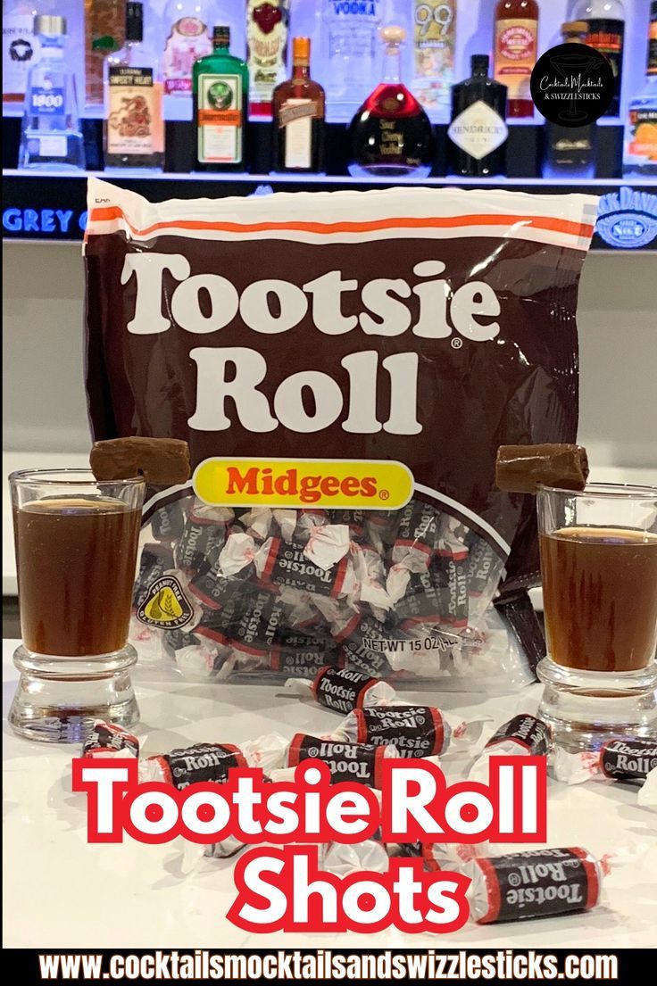 this image shows two brown shots with a tootsie roll garnish in front of a tootsie roll bag and a home bar with tootsie rolls scattered in front. Tootsie Roll Shot, Layered Shots, Candy Shots, Tootsie Rolls, Dessert Shots, Tootsie Roll, Jello Shots, Fun Shots, Time Of The Year