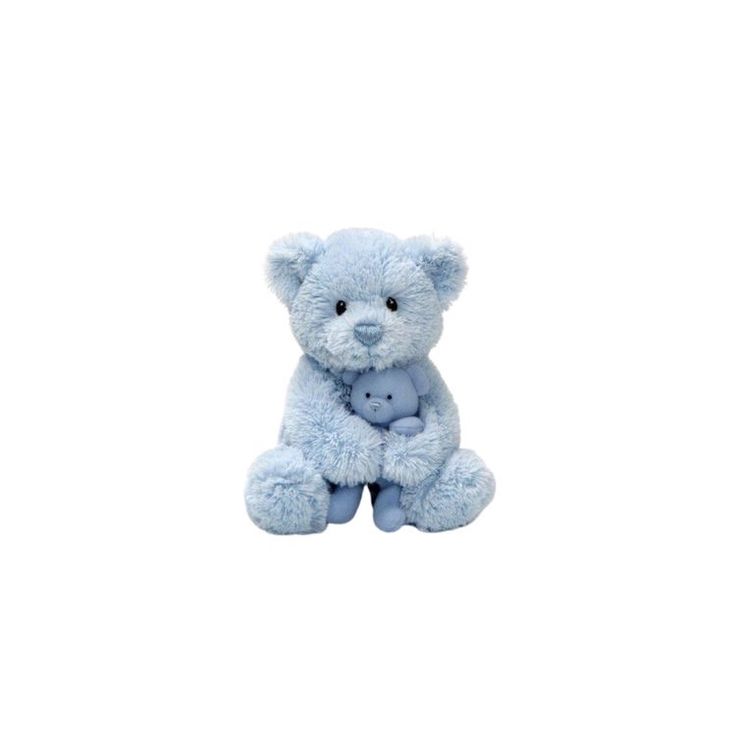 a blue teddy bear sitting on top of a white background