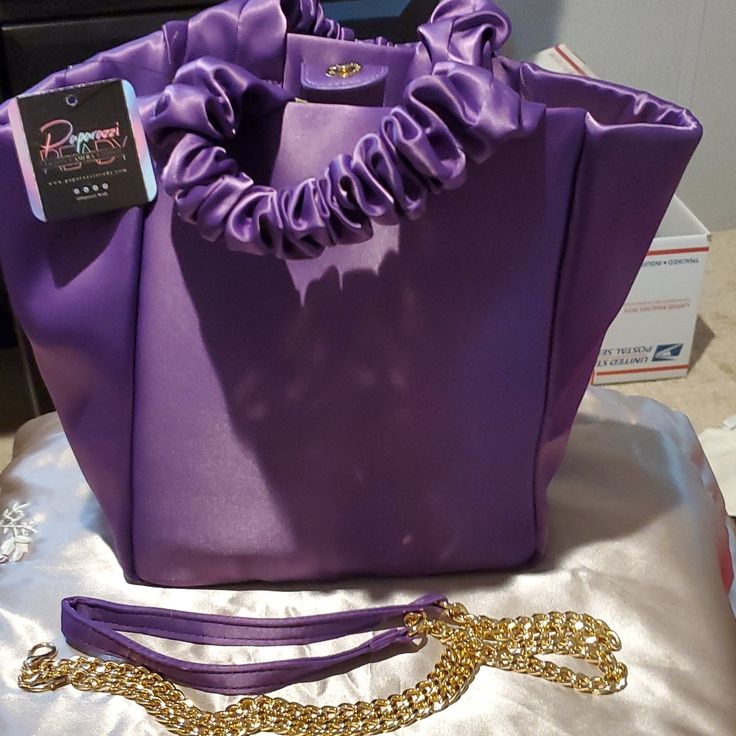 Purple Satin Purse By Paparazzi Has Scrunch Handles And Gold And Purple Satin Removable Strap. 9" By 9" Includes The Paparazzi Dust Bag To Store It In. Satin Purses, Gold And Purple, Purple Satin, Purple Gold, Purple Color, Color Purple, Shoulder Bags, Dust Bag, Handles