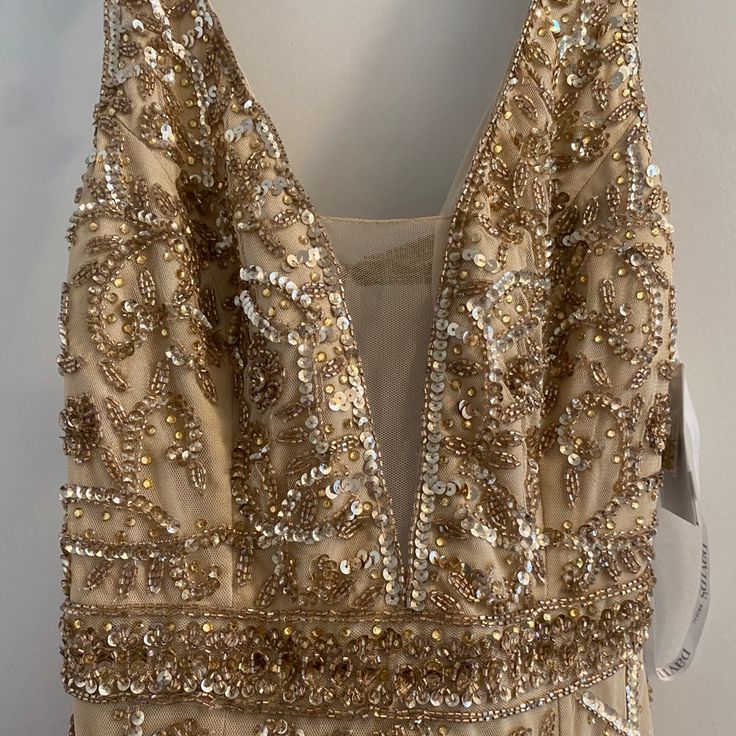 a dress with gold sequins on it