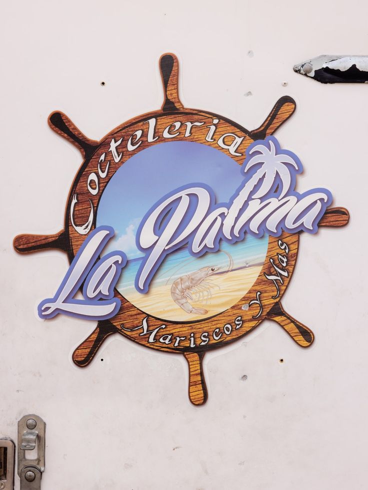 there is a sign for the restaurant called la puerta