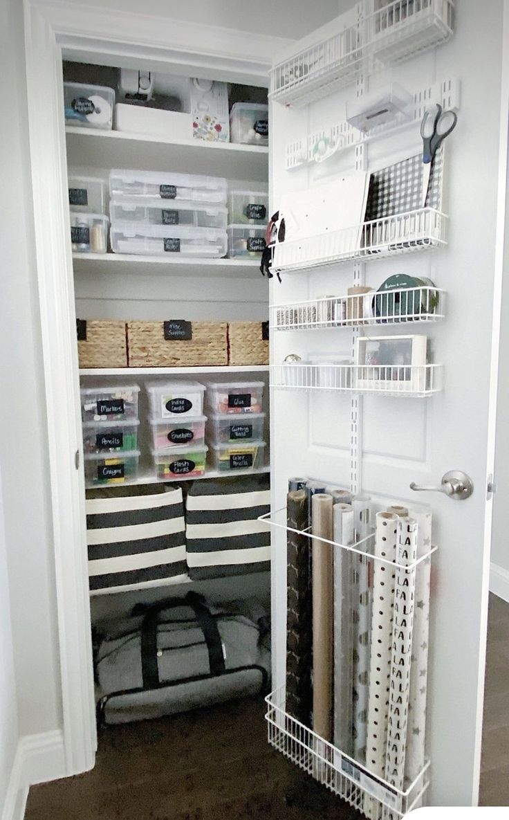 an organized closet with shelves and baskets