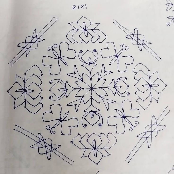 an image of a snowflake made with crochet and thread on paper