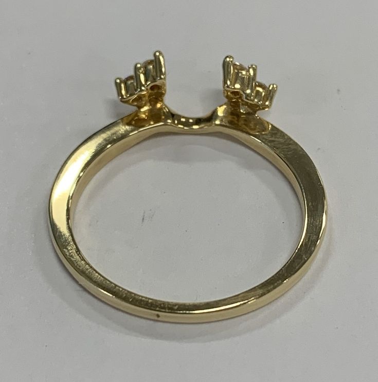 Here is a lovely 14k yellow gold diamond wrap. This wrap has 6 round brilliant diamonds totaling .16ct. Great to pair with your engagement ring! Metal: 14k Yellow gold Stones: 6 RB- .16cttw H SI-1 Size: 6.5 Weight: 2.3 grams SKU# 20CB115317AQO If you have any questions on this item, please message us! GandDJewelers.etsy.com Please note that all of our pieces have been analyzed & identified by a Gemological Institute of America Certified Specialist. Additionally, our store is located in the h Marquis Engagement Rings, Gold Diamond Band, Bezel Set Diamond, Ring Metal, Diamond Band, Brilliant Diamond, Diamond Bands, Gold Beads, Metal Rings