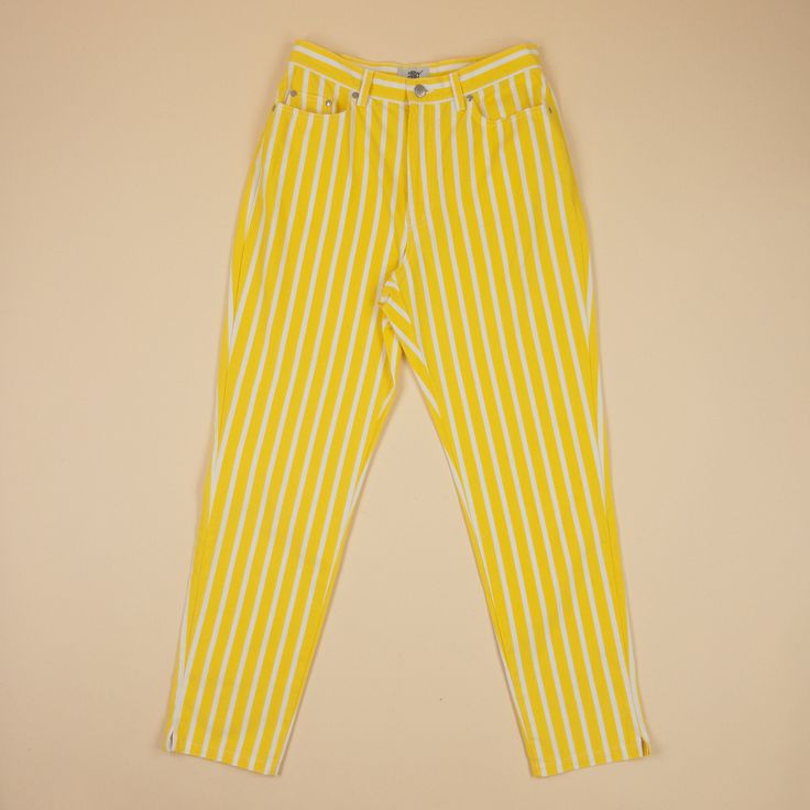 Yellow and white striped cotton pant. Size 42F 100% cotton Made in France Measurements are taken flat and are approximate : Waist 36,5 cm Front rise 33 cm Lenght 73 cm In 1967, two French guys returned from a trip to California, with the desire to create a brand conveying the lifestyle they discovered there. New Man was created the same year and specializes in men's and women's ready-to-wear. They come up with a great slogan "Life is too short to dress sad!". --- Kind reminder All sales are final.  Vintage clothing is by definition imperfect and comes with little flaws... Which contributes to their charm. Please bear this in mind and ask questions before purchasing an item. Pinstripe Tapered Leg Cotton Bottoms, Pinstripe Cotton Tapered Leg Bottoms, Pinstripe Cotton Pants With Tapered Leg, Pinstripe Cotton Tapered Leg Pants, Pinstripe Cotton Bottoms With Tapered Leg, Relaxed Fit Striped Cotton Pants, Retro Cotton Pants With Vertical Stripes, Relaxed Fit Striped Cotton Bottoms, Pinstripe Cotton Trousers