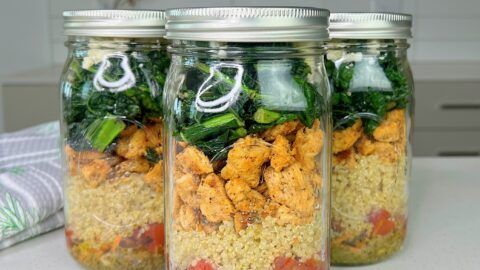 three mason jars filled with food on top of a table