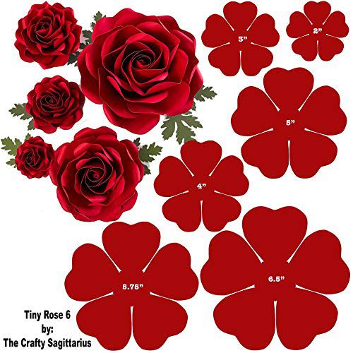 paper flowers are arranged in the shape of hearts and four roses with leaves on them