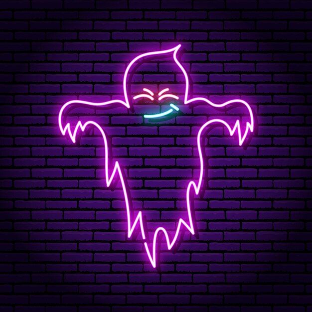 a neon sign with a ghost face on it in front of a dark brick wall