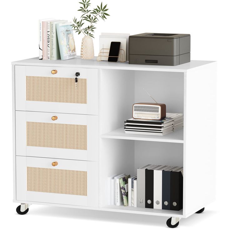 a white bookcase with drawers and some books on it's sides, next to a printer