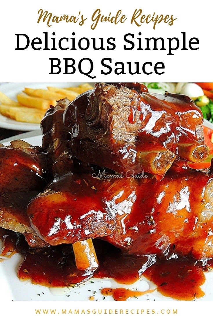 a white plate topped with meat covered in bbq sauce