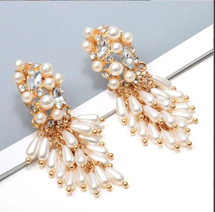 Add a luxurious touch to any outfit with these classic and timeless JLO Earrings. Crafted from pearls imitation and alloy, they are sure to become your go-to accessory. Whether you're dressing up for a night out or adding some sparkle to your office look, these earrings will make a statement. Size: 2.55 in x 0.78 in Main Material: Gold Plated | Stainless Steel Stone: Pearls Material Type: Alloy Warranty: Hypoallergenic | Safe for Sensitive Skin *Slight natural variations may occur between colors Office Look, Donate To Charity, Classic Jewelry, Ear Cuff, Grapes, Night Out, Pearl Earrings, Gold Plate, Size 2