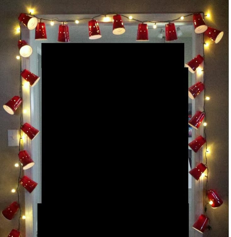 a mirror decorated with red cups and lights