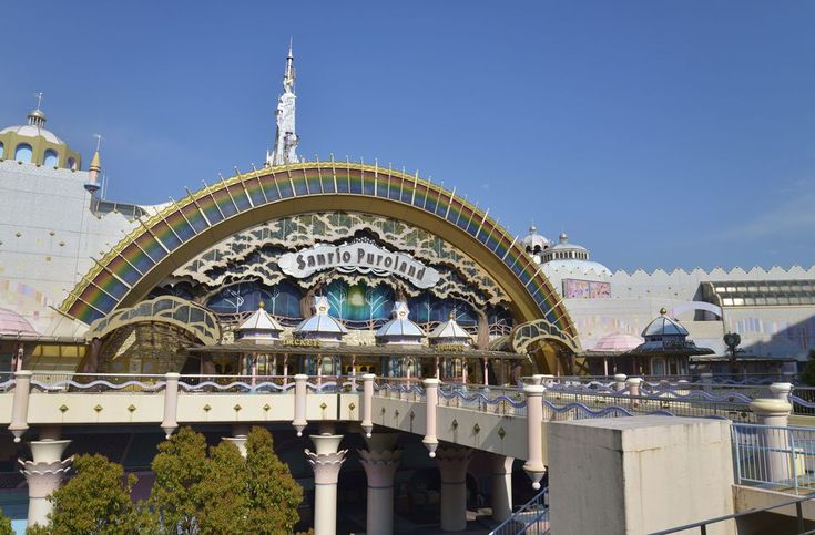 the entrance to disneyland's california adventure park is painted white and blue with gold trim