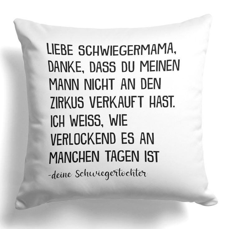 a black and white pillow with the words in german on it's front side