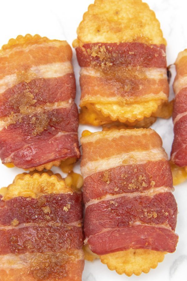 bacon wrapped crackers sitting on top of each other