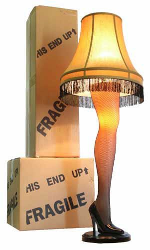 a lamp that is sitting on top of a table next to a box with the word fragile written on it