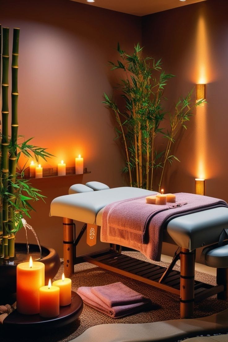 a spa room with candles and towels on the table