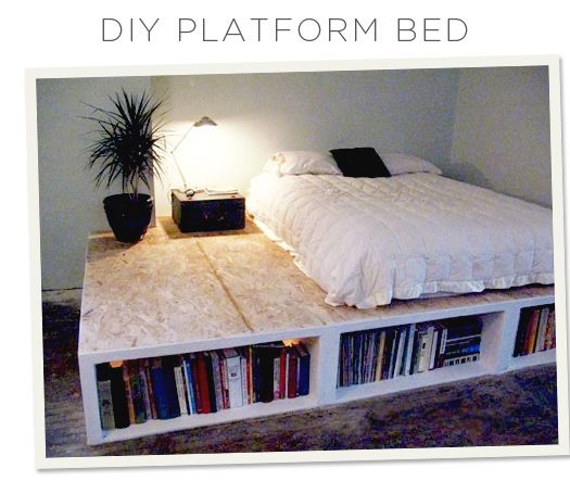 a bed made out of bookshelves in a room