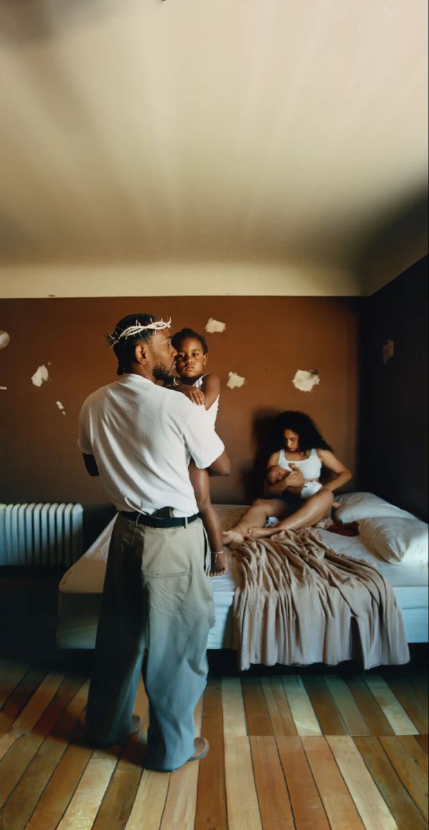 a man standing next to a woman on top of a bed