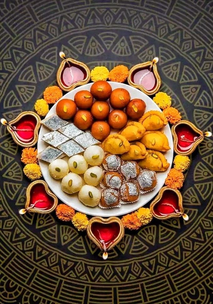 a plate filled with different types of food on top of a black and gold table