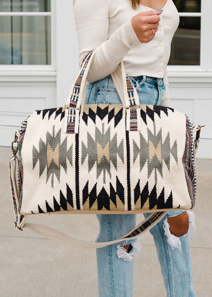 Beautifully handwoven ethnic motif duffel bag .   The duffel bag will be your go-to travel bag for year-round use! Cream, tan, black & gray Aztec inspired duffel Zipper closure w interior zipper & 2 open pockets 19" x 9" x 11" 100% Cotton 100% Cotton *Handwoven *Versatile and convenient *Used for a variety of purposes, including travel, sports, beach, camping, work, and everyday use Thank you for visiting my shop! Please note that I make every effort to ship orders promptly, usually within one t Western Bag, Into The West, Sac Week End, Graphic Tee Dress, Duffel Bags, Duffel Bag Travel, Pretty Patterns, Handmade Boho, Aztec Print