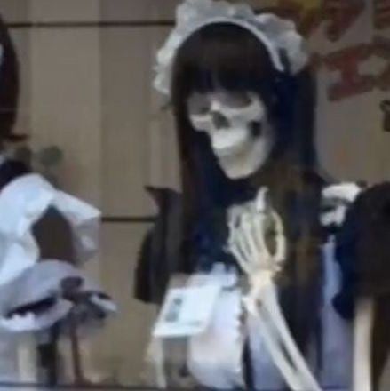 two women dressed up in skeleton makeup and costumes